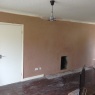 Steve Deprez Builders - Patched in and re-skimmed fire place exterior and wall.