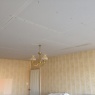 AWP Plastering Services - A badly artexed ceiling over boarded ready to skim
