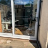 TRADEFRAME.COM LTD - Clear Round Cat Flap In Patio Slider Glass OUTSIDE VIEW