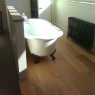 Crescent Carpentry & Building Ltd - roll top bath raised on oak floor